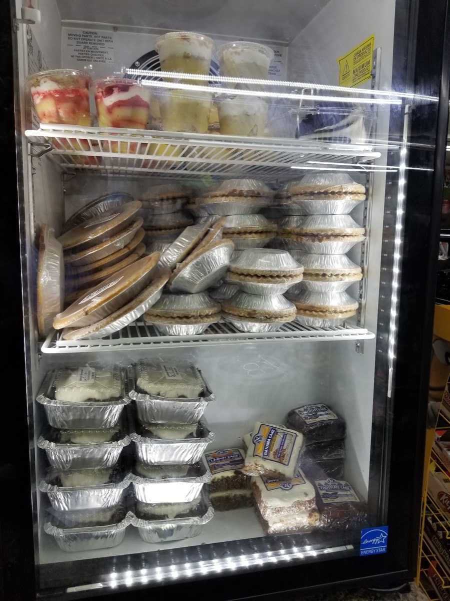 Cooler stocked with cakes, pies and puddings