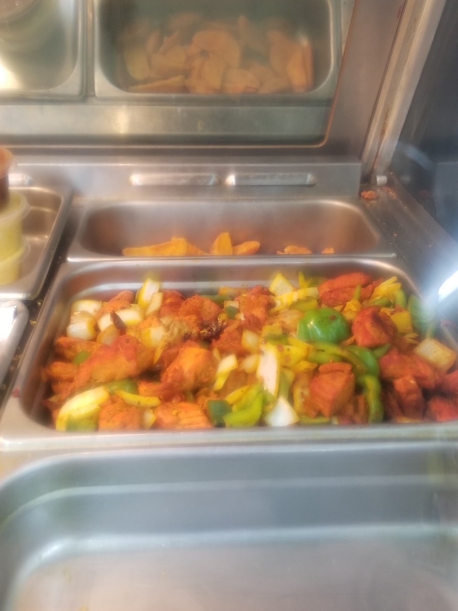 Hot food tray with chicken, peppers and onions